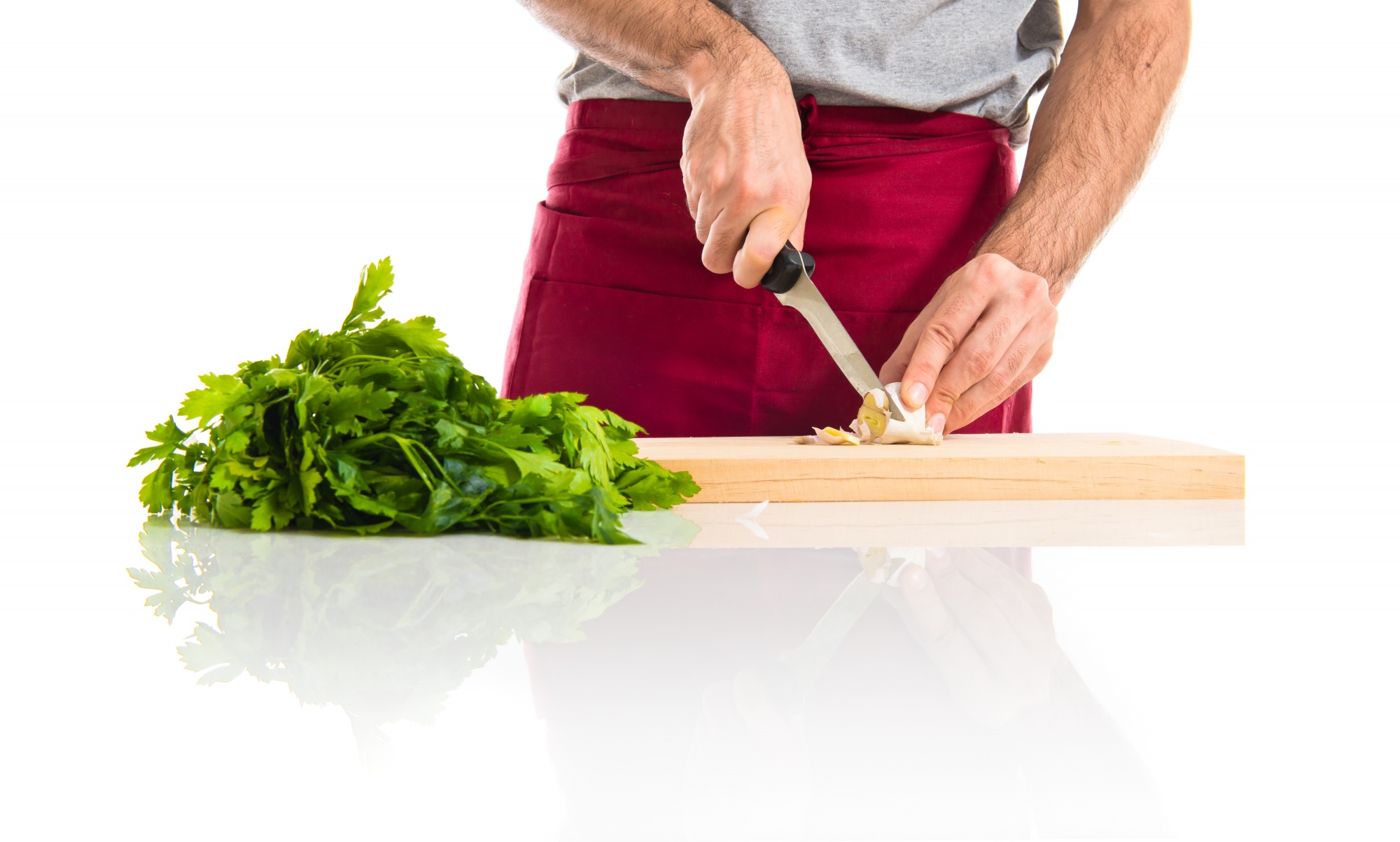 Chef hands preparing ingredients on wooden board